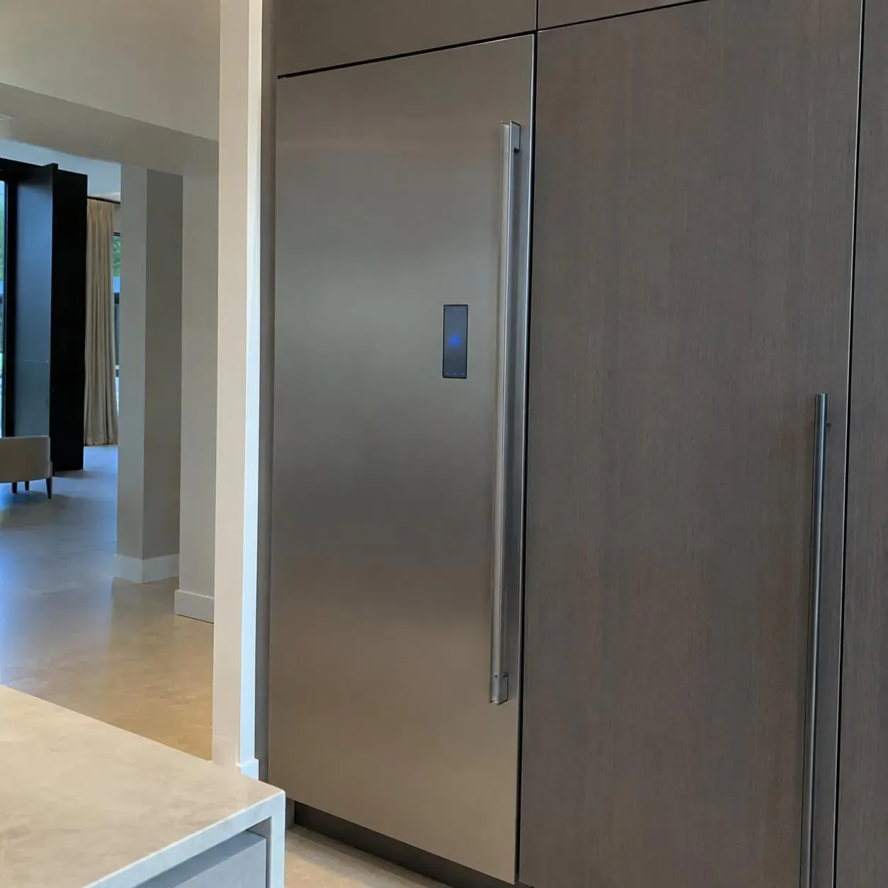 Contemporary dark-stainless built-in column refrigerator with a glass touch panel