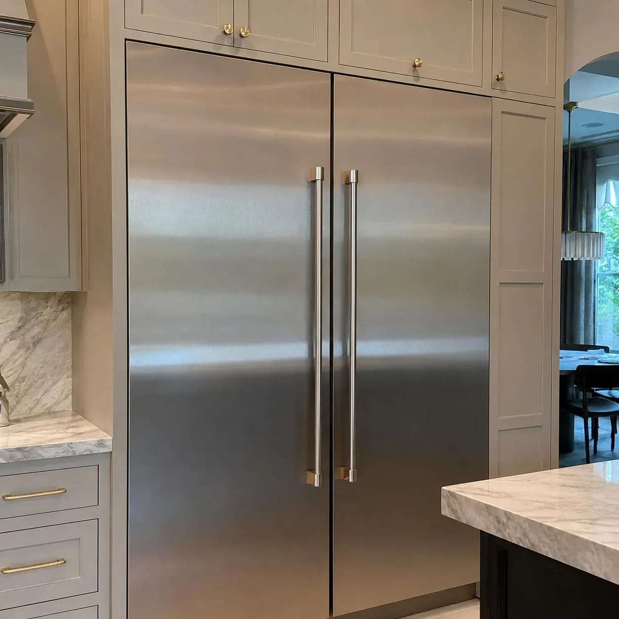 Built-in stainless column refrigerator and freezer pair in fine cabinetry